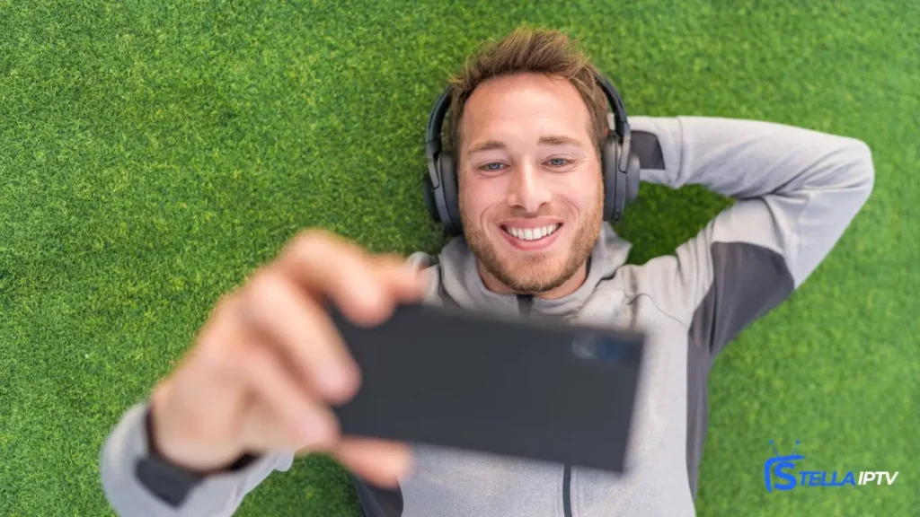a man watching iptv on phone