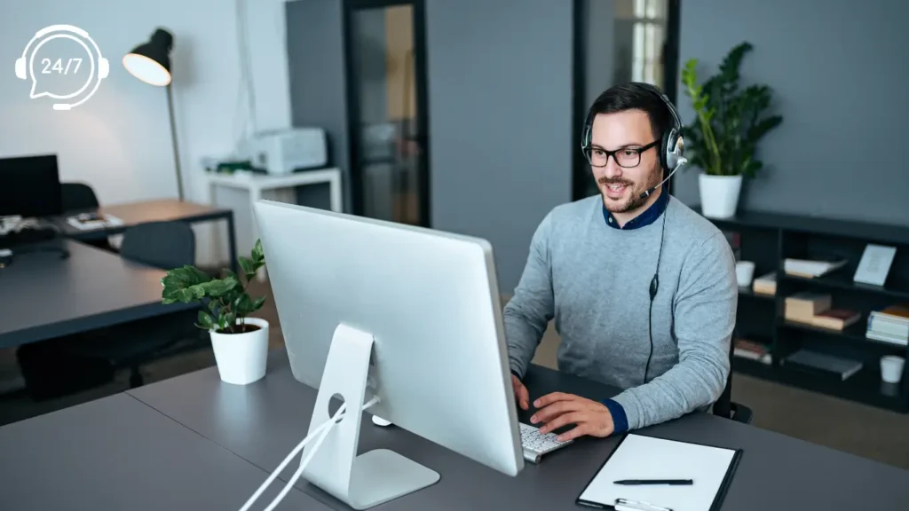Man working at desk with headset